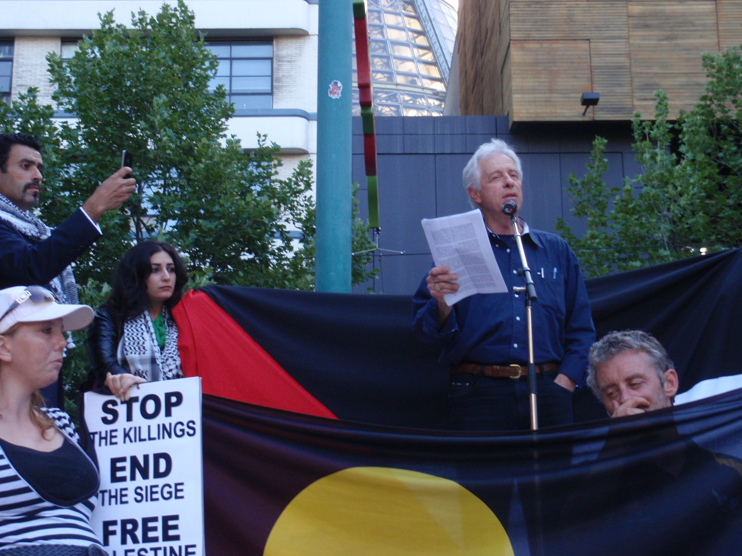 Phot of Peter Slezak speaking at protest rally