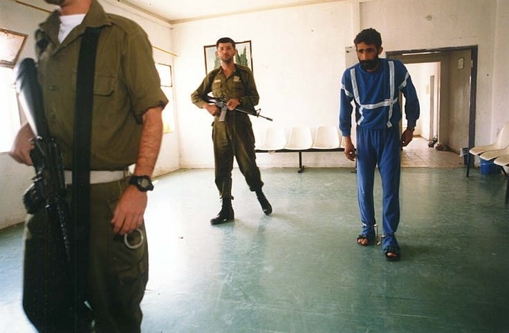 Palestinian Prisoner with Two Israeli guarts
