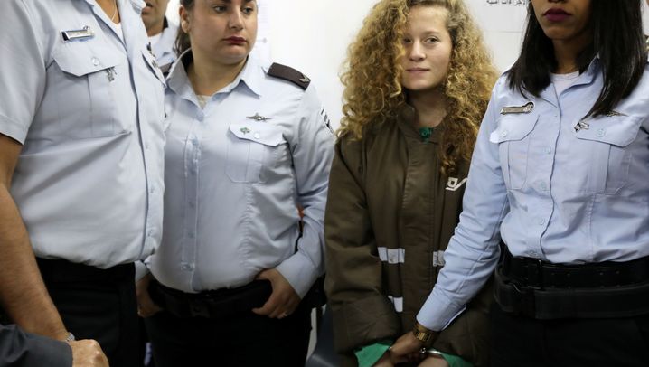 Ahed Tamimi with Israeli guards