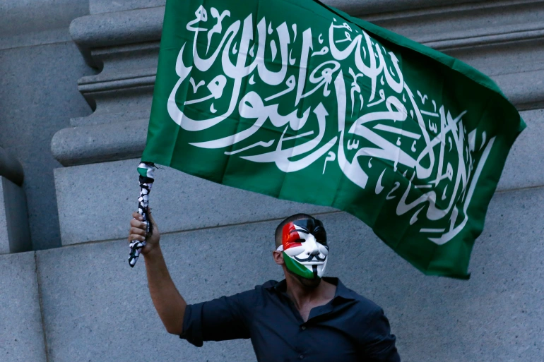 Photo of a person waving a Hamas flag