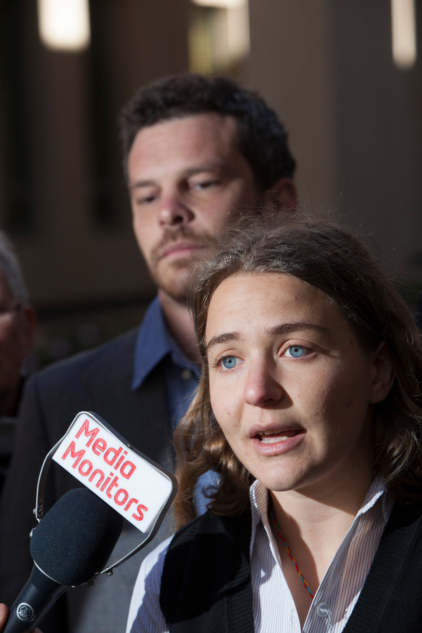 Sahar Vardi speaking into a microphone at press conference at parliament house