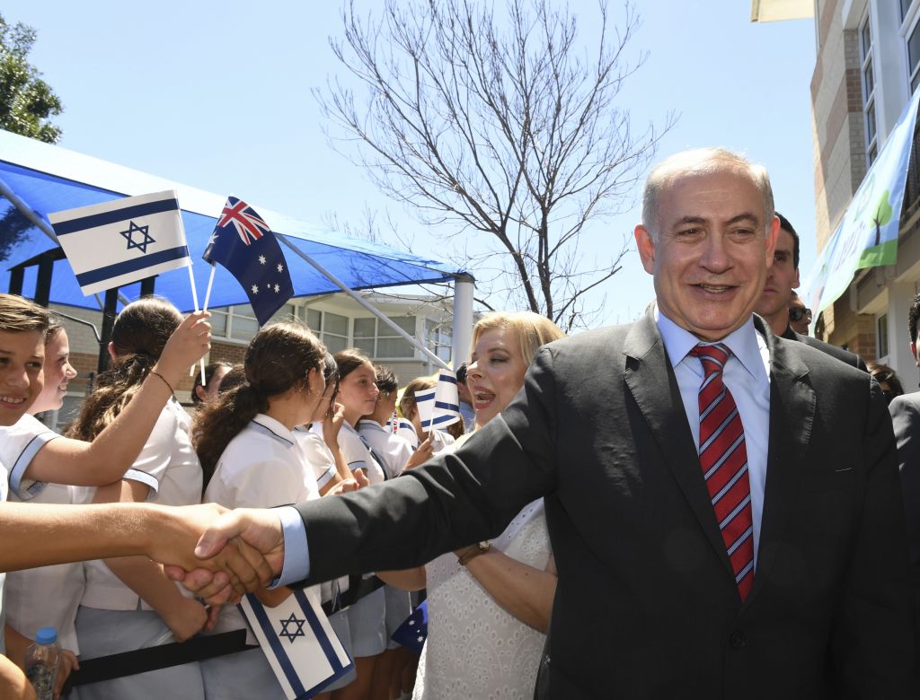 Photo of Israeli Prime Minister Netanyahu in Australia with people waving Australian and Israeli flags