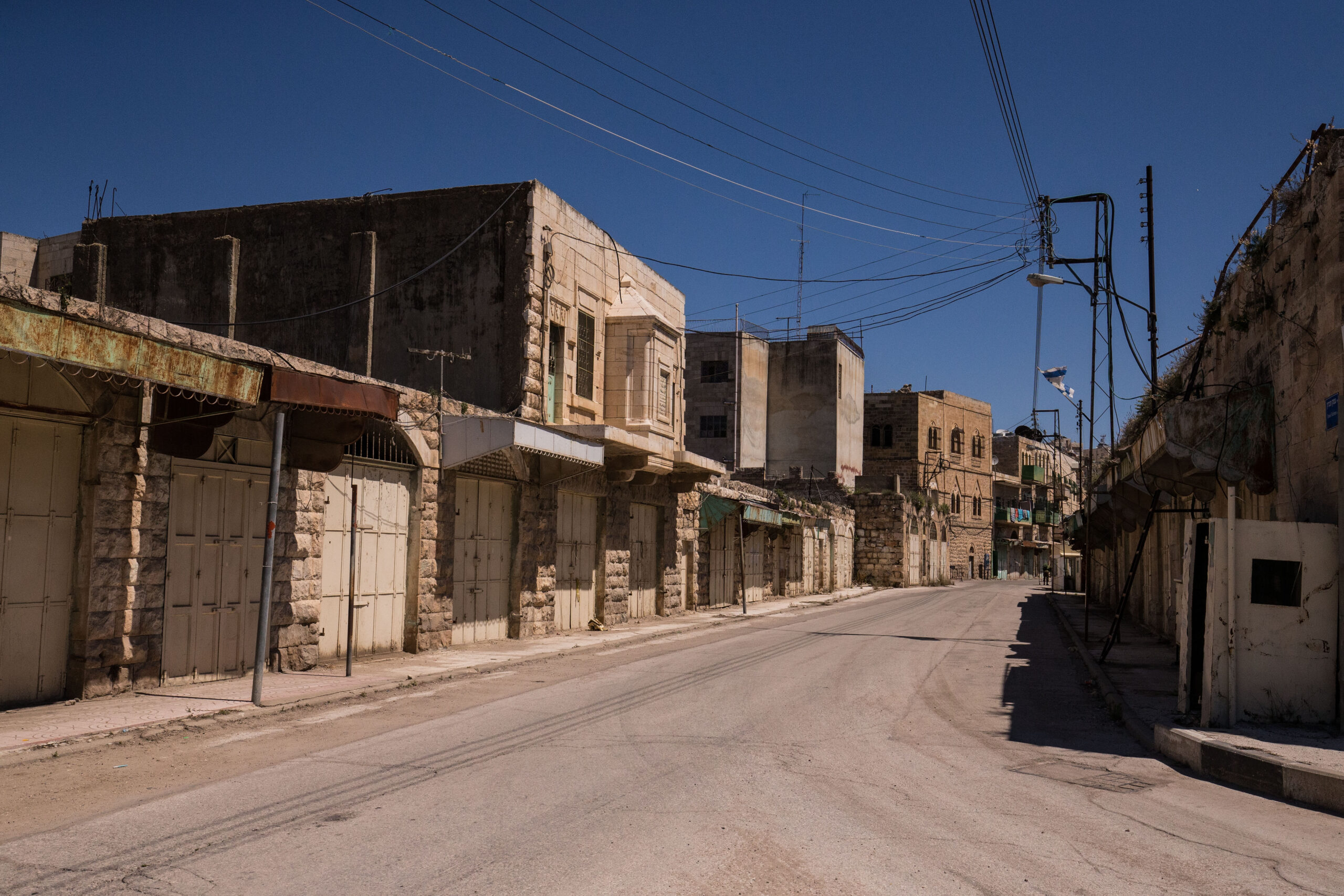 Photo of al-Shuhada Street empty of people