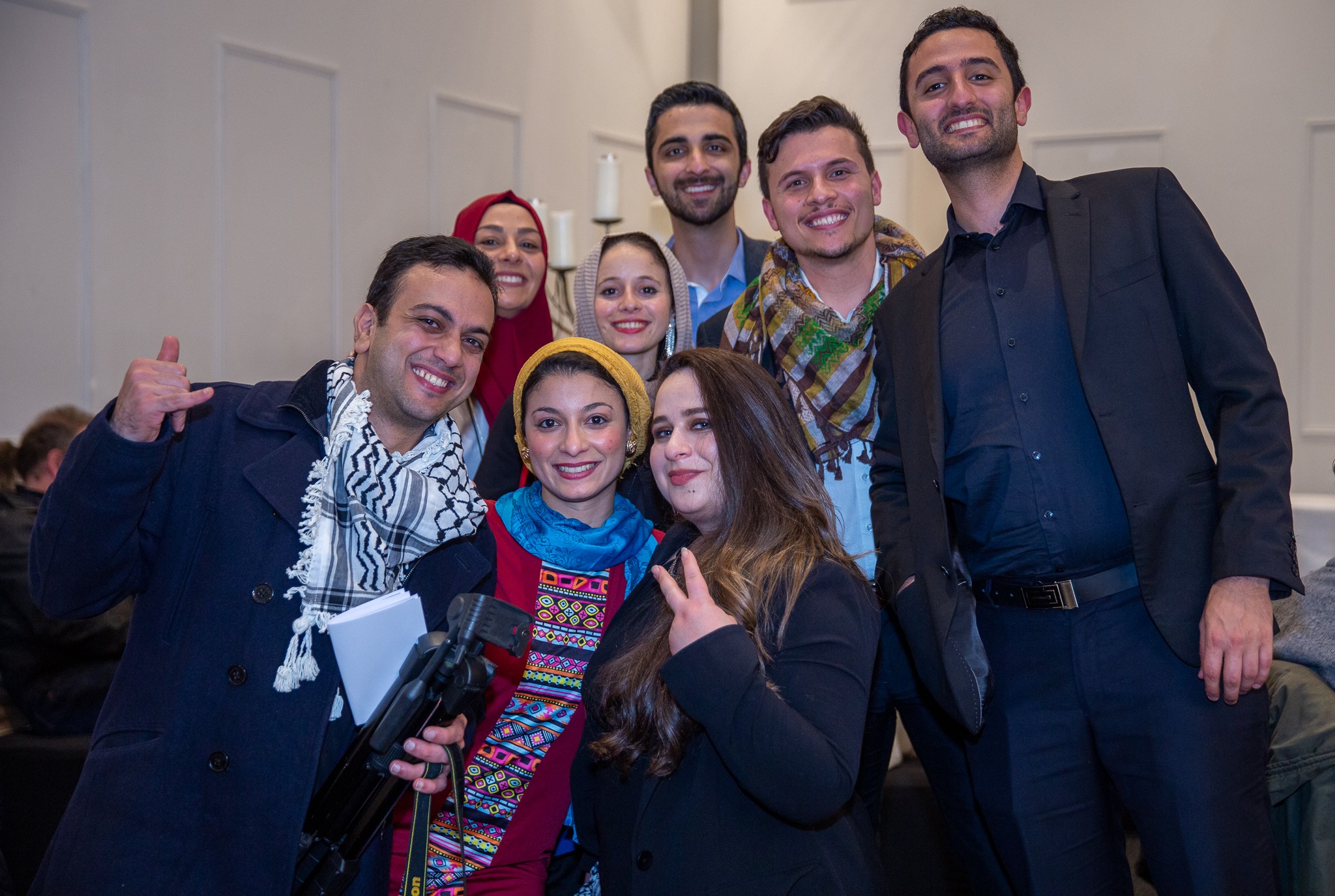 Group of young Palestniians with Kuffiyehs and traditional Palestinian dress
