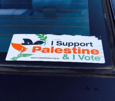 Sticker on theback window of a car stating "I support Palestine & I vote"