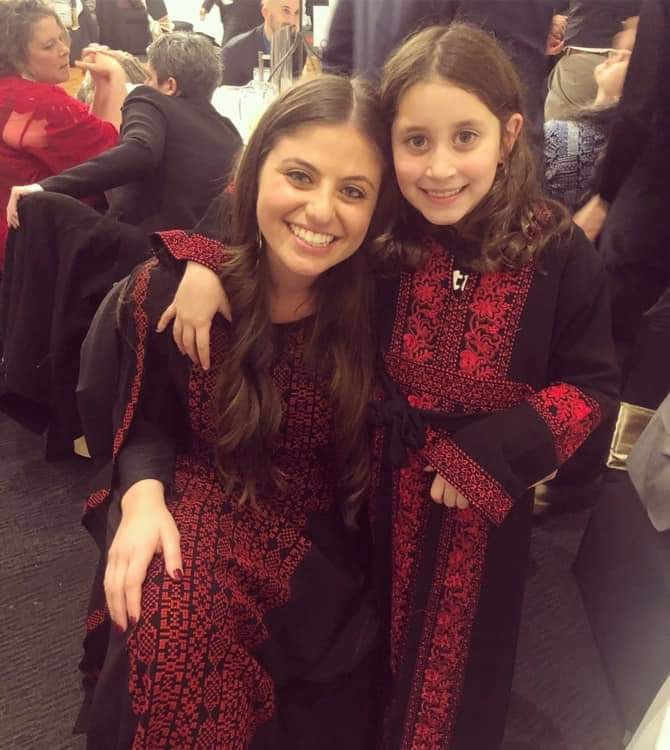 Two Palestinian girls in Thaobs- traditional dresses